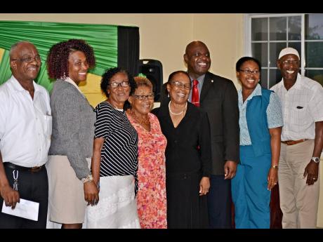 President of the St Mary Chamber of Commerce Frederick Young (third right) and executive members of the organisation take advantage of a photo opportunity. From left: Earle Irvin, Prudence Charlton-Richards, Valerie Neil, Cynthia Loney, Margaret Harvey-Williams, Maureen Cunningham Johnson and Mekaeel Maknoon.